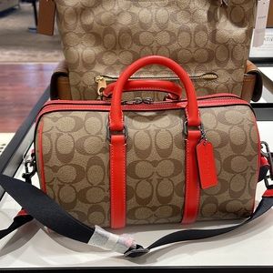 Coach men's Venturer Crossbody 27 In Colorblock Signature Canvas
QB/Khaki/Miami